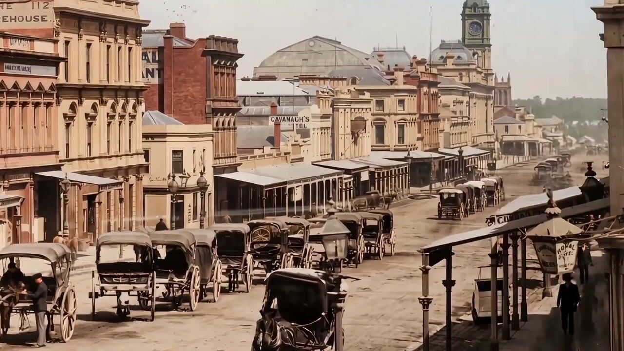 Colourised historic photograph of a Melbourne street with horse-drawn carriages and shopfront verandahs